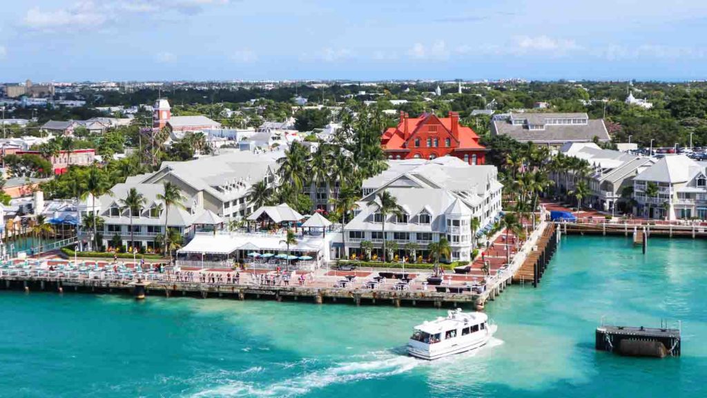 View of Mallory Square showing the restaurants and square with boats in front - Key Wesy FL